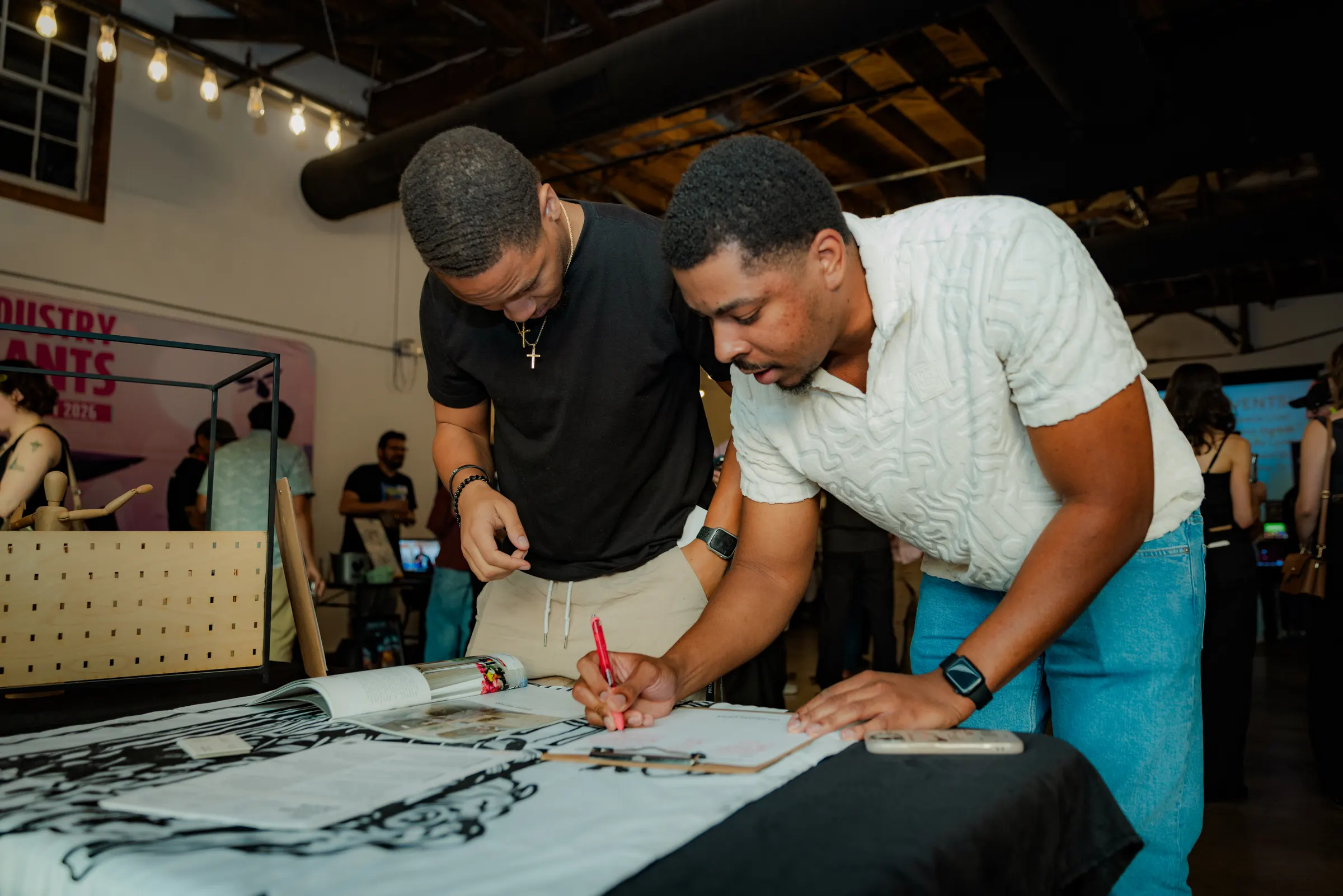 Creatives sketching together on a tabletop