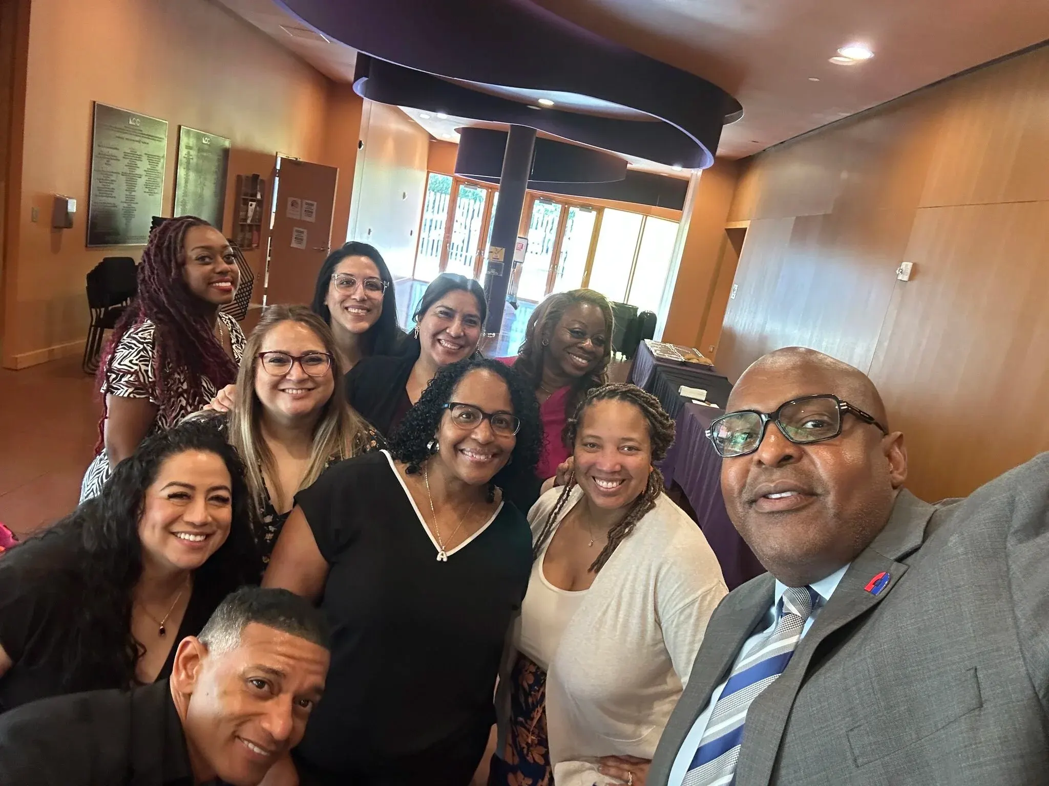 Partnership members taking a group selfie